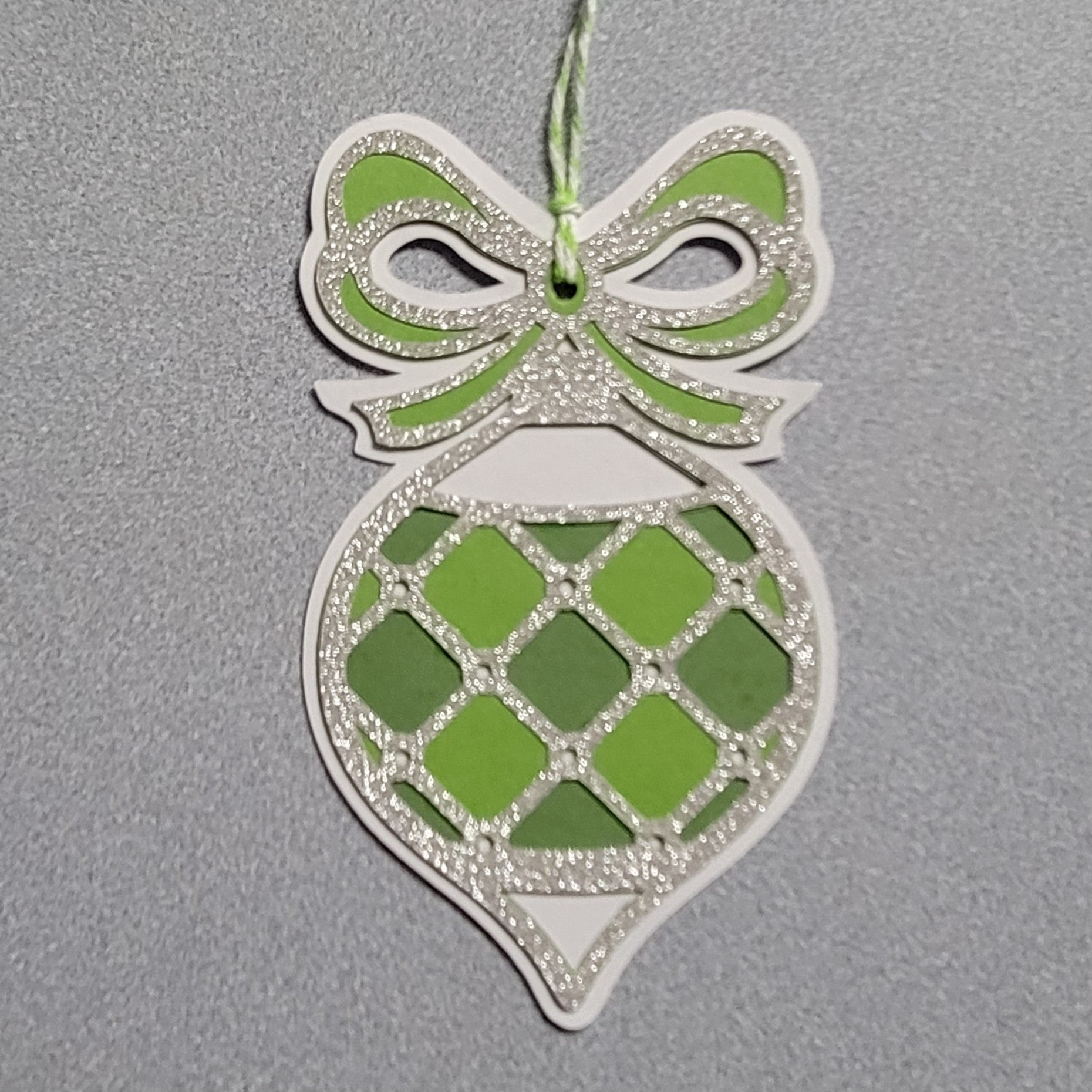 Green and silver ornament gift tag.