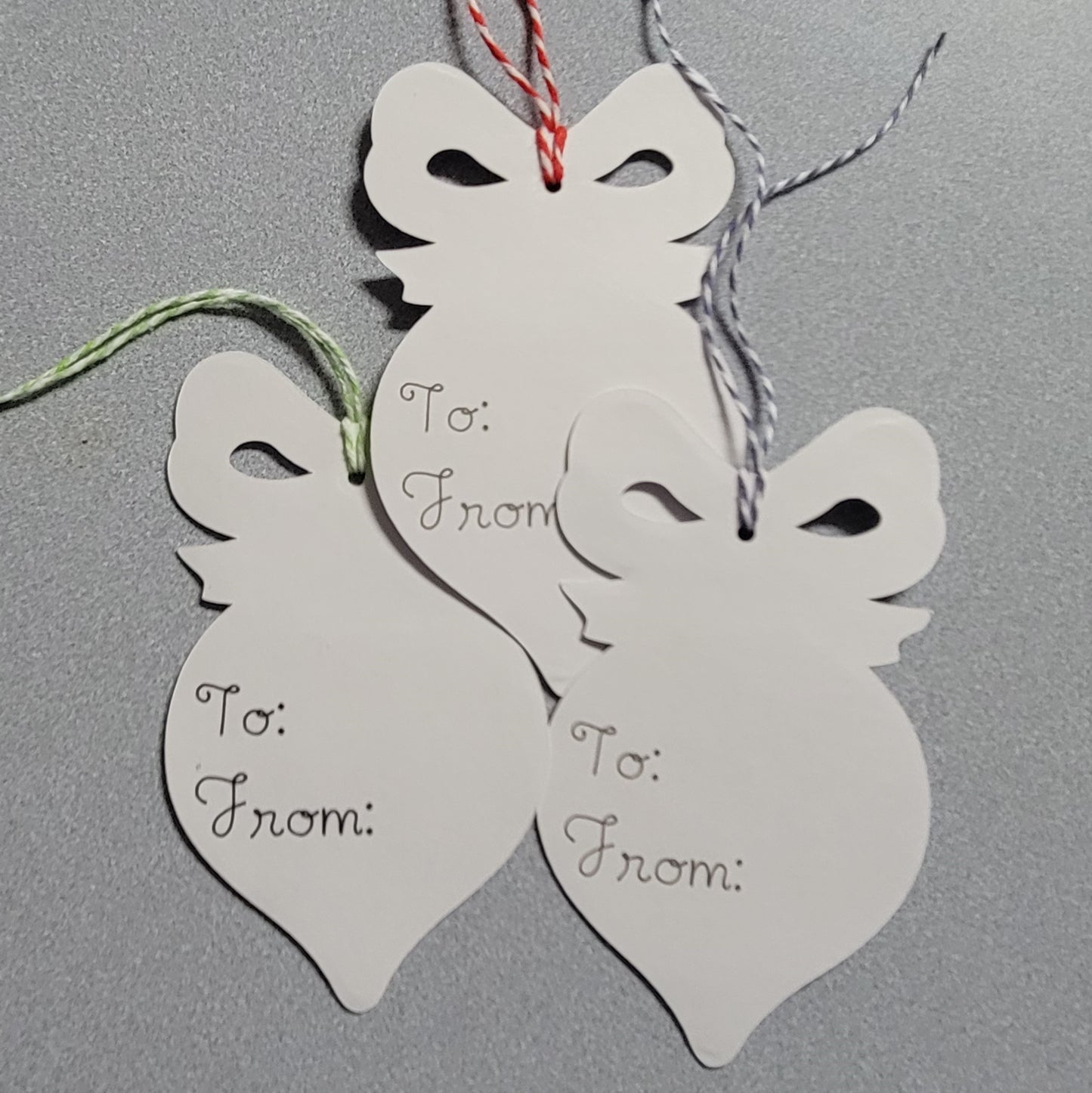 Back side of silver ornament gift tag set.